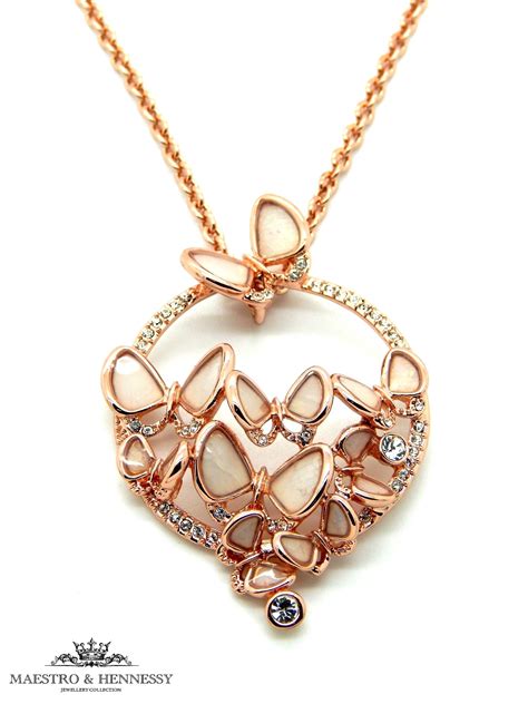 Delicate pearl necklace with freshwater pearls dotted on a rose gold filled trace chain. MOTHER OF PEARL BUTTERFLY ROSE GOLD PLATED NECKLACE - Maestro & Hennessy