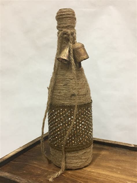 Twine Wrapped Wine Bottle With Gold Ribbon And Rustic Bell Etsy