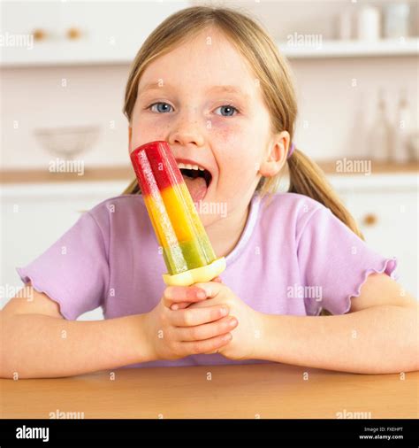 Girl Licking An Ice Lolly Stock Photo 102354192 Alamy