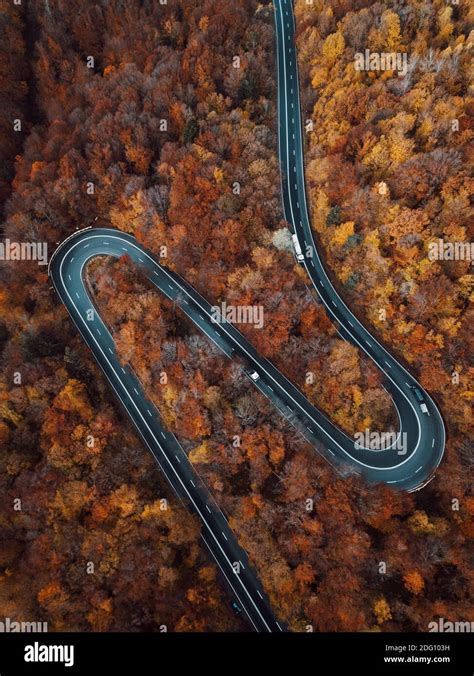 Aerial View Of Countryside Road Passing Through The Colorful Autumn