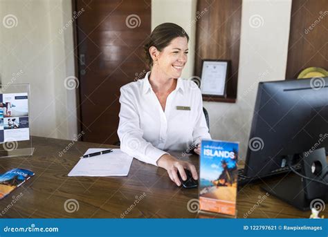 Female Resort Receptionist Working On A Computer Stock Image Image Of