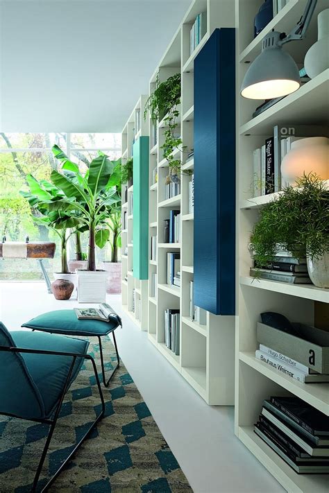 Natural greenery adds to the vibrant style of the wall unit system