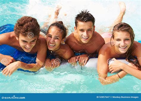 Group Of Teenage Friends Having Fun In Swimming Pool Stock Image
