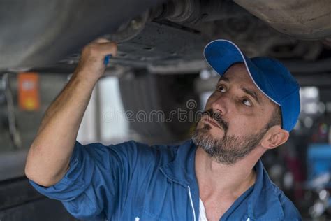 Mechanic Man With Clipboard Checking Car System At Workshop Mechanic