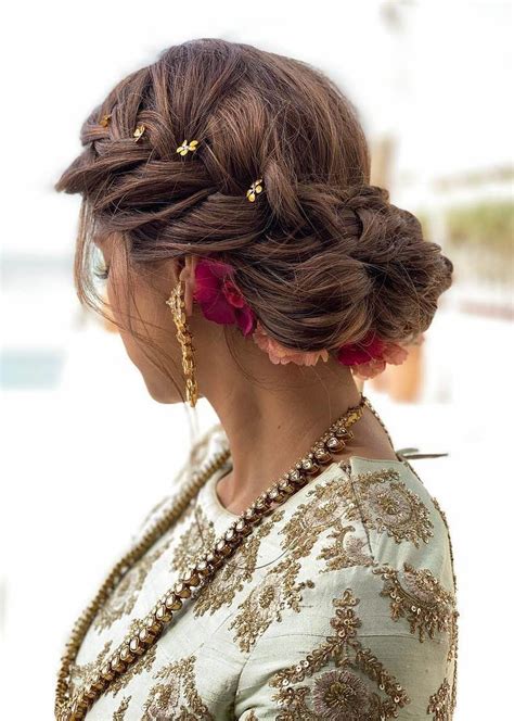 Summer wedding hairstyles have been changing each single year and through this post we will be giving the brides with the complete details regarding stylish in this hairstyle you will be gather all the hairs together tightly and then twist it up to give it the form of a bun. Best 31 Braided Bun Hairstyles For Brides-To-Be! | ShaadiSaga