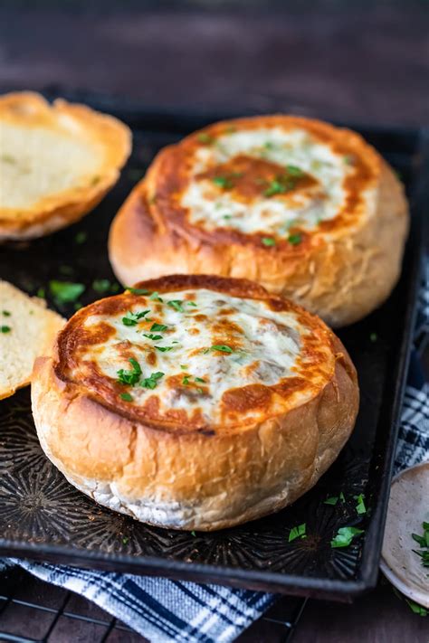Seasoned ground beef, topped with provolone cheese and wrapped in pizza philly cheese bread recipe. Philly Cheese Steak Soup in a Bread Bowl - Cravings Happen