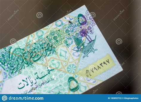 Check spelling or type a new query. Persons Hand Giving The Currency Of The Qatar - Green Five Rial Or Riyal Notes Spread Out On A ...