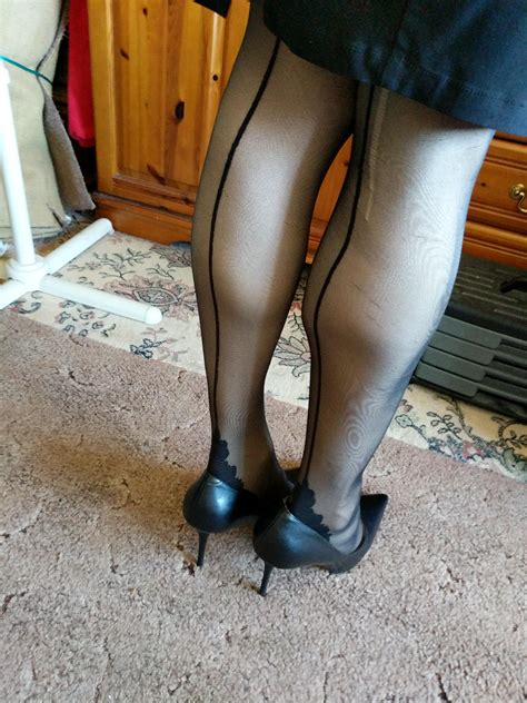 put on my black pencil skirt seamed nylons and black stiletto leather heels i hope the seams are