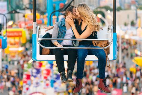 two women kissing on a carnival ride by stocksy contributor jen