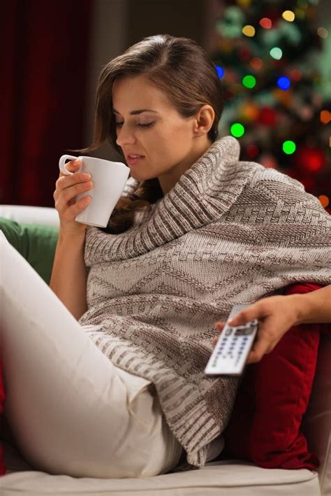 Young Woman Drinking Hot Chocolate And Watching Tv Stock Photo Image