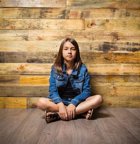 Young Serious Girl Sitting On Floor Stock Photo Image Of Sitting