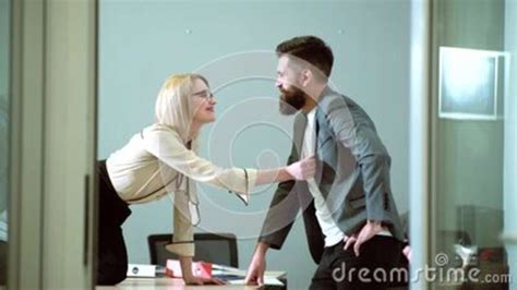 secretary and boss female office worker flirting with employee in workplace stock footage
