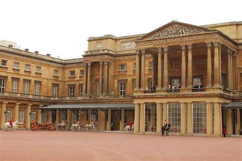 The Carriage Procession Arrives At The Grand Entrance Of Buckingham