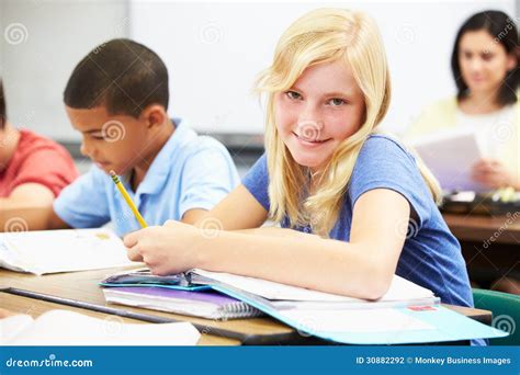 Pupils Studying At Desks In Classroom Stock Photography Image 30882292