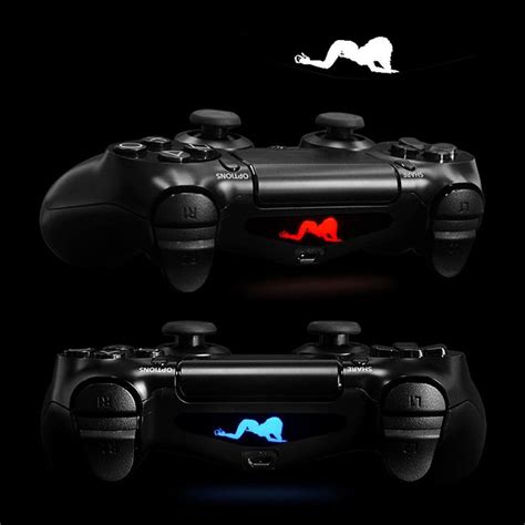 A Black Video Game Controller With Red And Blue Light Coming Out Of The