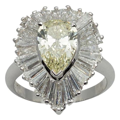 1.59 ct diamond engagement ring with baguettes. Platinum Pear and Baguette Diamond Ballerina Ring with Yellow Diamond Center For Sale at 1stdibs