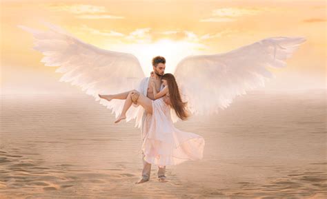 Strong Male Costume Angel Holds Hug Fragile Innocent Woman In Arms
