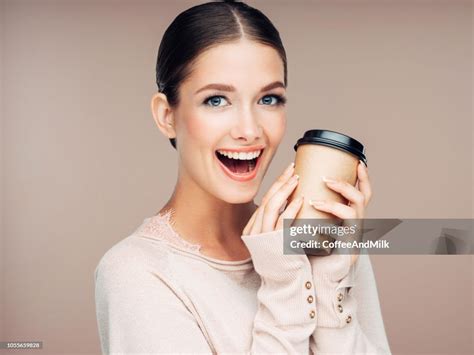 Young Woman Holding Hot Coffee High Res Stock Photo Getty Images