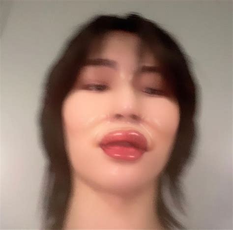 A Blurry Photo Of A Woman S Face With Her Eyes Closed And Mouth Open