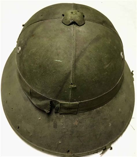 North Vietnamese Army Sun Helmet With Badge Bullethole Doves Flag And
