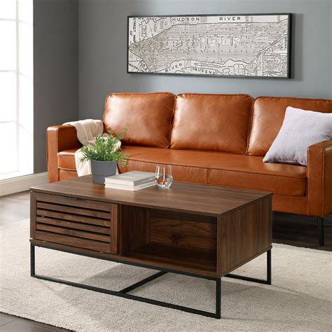 The x design side feature ensures the structure is study and the simple lines add a touch of charm to any room.this coffee table is finished in sleek black and constructed of mdf board with the legs made from selected pine woods. Welwick Designs 42 in. Dark Walnut/Black Large Rectangle ...