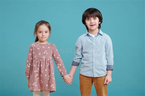 Adorable Little Boy And Girl Holding By Hands Stock Photo Image Of