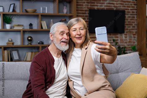 Mature Happy Couple Fooling Around On Smartphone Camera Gray Haired