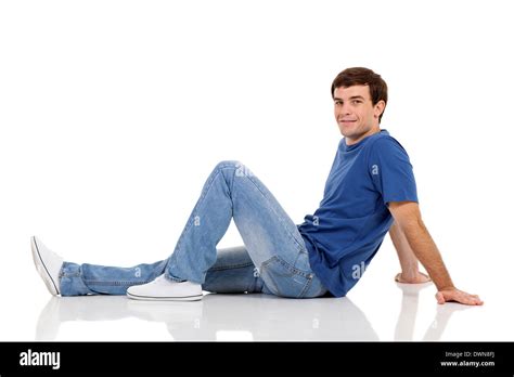 relaxed man sitting on the floor on white background Stock Photo - Alamy