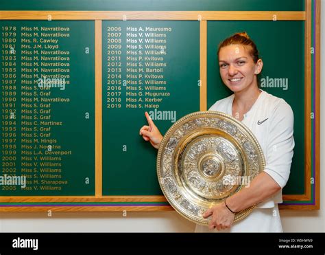 2019 Wimbledon Ladies Singles Champion Simona Halep Standing By The Winners Board At The
