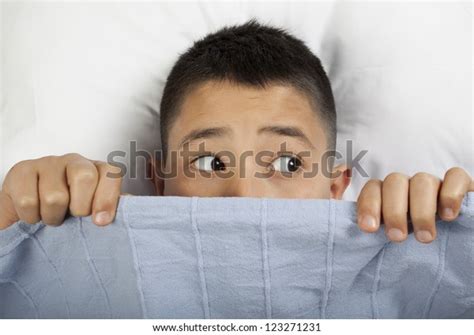 Scared Boy Hiding Bed Stock Photo Edit Now 123271231