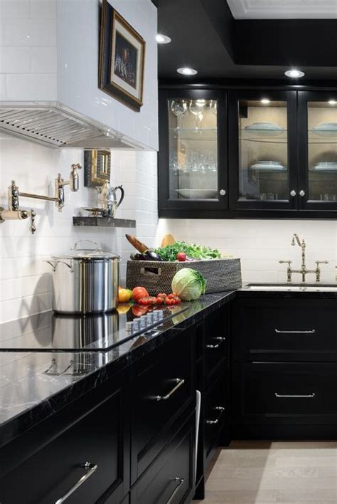 This kitchen by urrutia design features a highly composed mix of colors and textures. 30 Sophisticated Black Kitchen Cabinets - Kitchen Designs ...