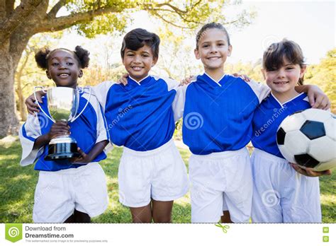 Children Soccer Team In Raw Smiling Stock Image Image Of