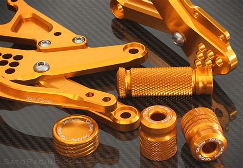 Place the aluminum part in the warm dye bath. SATO RACING 'GOLD' anodized parts