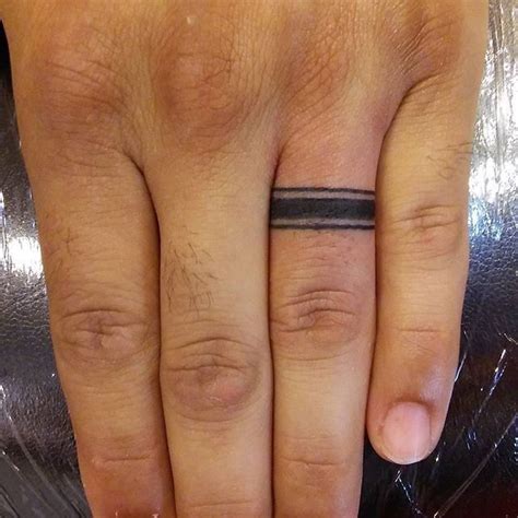 Pin By April Fullman On Tattoos Ring Tattoo Designs Tattoo Wedding Rings Wedding Ring Tattoo