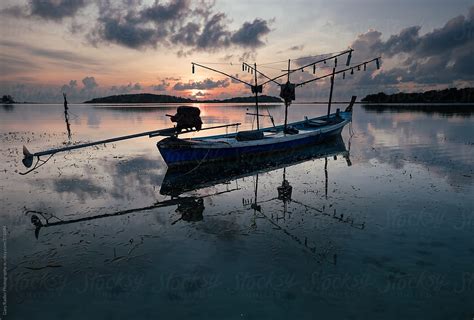 Traditional Thai Fishing Boat Moored On Beach By Stocksy Contributor