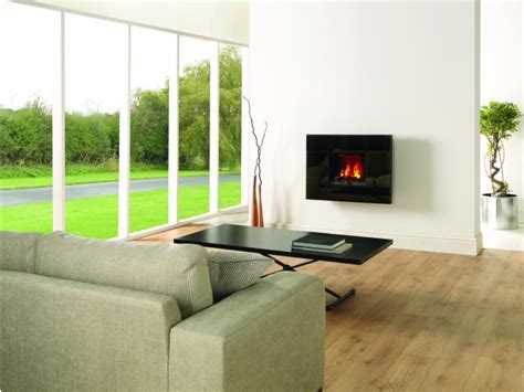 Freestanding wood stoves can bring a timeless elegance and warmth to virtually any room; Dimplex Optimyst wall mounted electric fires - Focus Fireplaces and Stoves