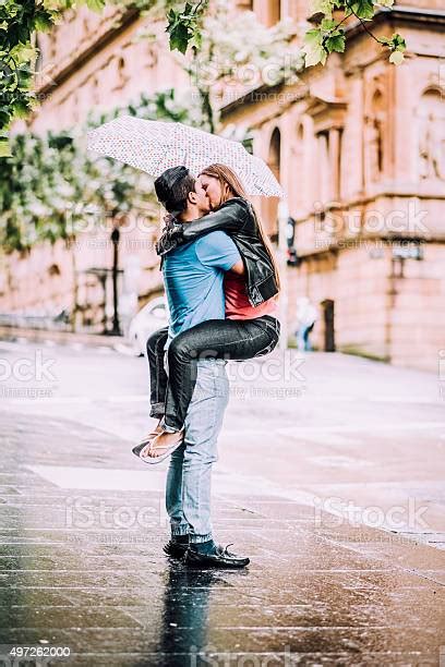 Kissing Under Umbrella Stock Photo Download Image Now Kissing Rain