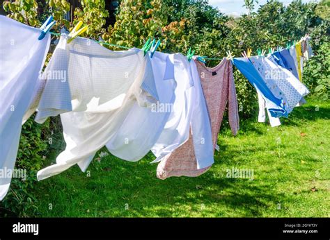 Laundry Drying Pegged To Clothesline Hi Res Stock Photography And