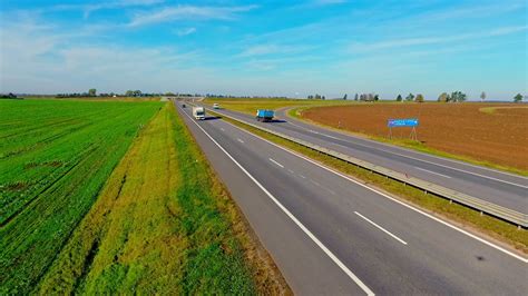 Traffic highway aerial landscape. Aerial view trucks and cars driving on highway road. Cars ...