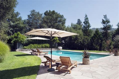 Backyard Swimming Pool With Teak Patio Lounge Chairs Hgtv