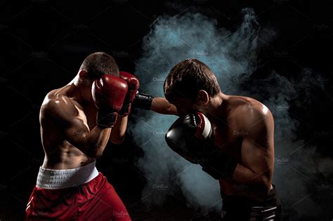 Two Professional Boxer Boxing On Black Smoky Background Featuring