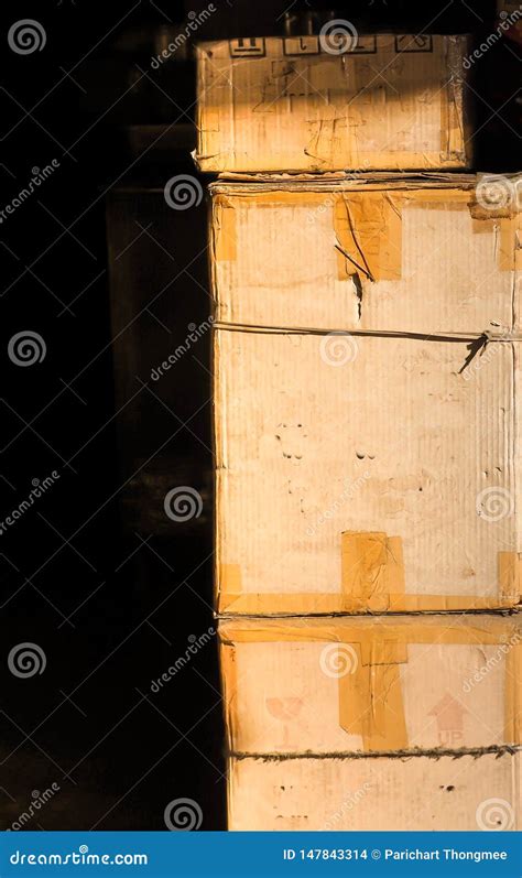 The Old Cardboard Box On A Black Background Cargo Post Shipment