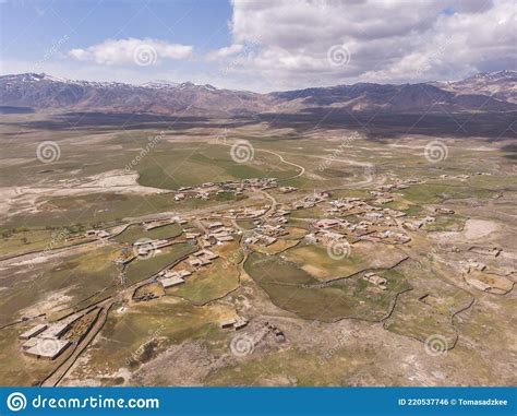 Aerial View On Anatolian Village With Clay Roofs At Foothill Of Mount