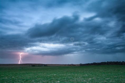 Lightning Striking The Ground Below A Spring Thunderstorm Stock Image