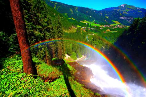 Rainbow And View Of Mountain Village