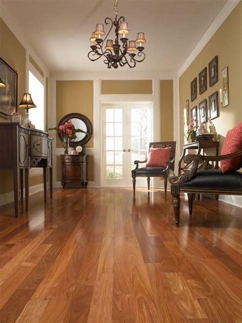 This living room proves that a room with dark wood floor can be bright too. Love the hardwood flooring, the furniture, the light ...