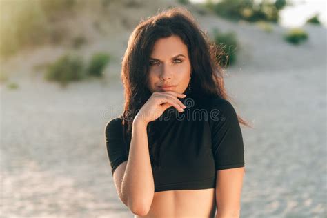 Portrait Of An Attractive European Woman Has Tanned Skin With Freckles From The Sun Posing On
