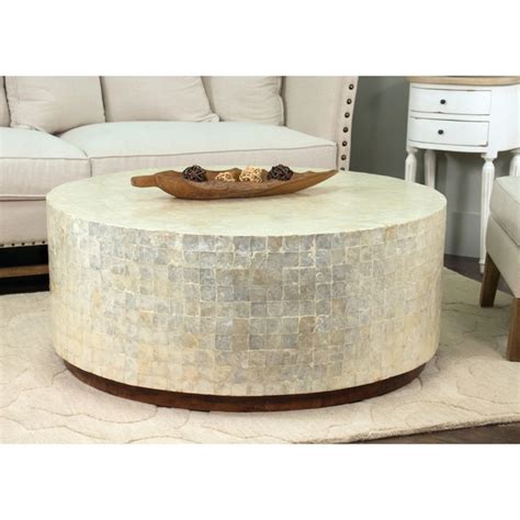 However, the traditional rectangle remains the most popular shape as it provides a slim profile that serves its function while leaving plenty of floor space for maneuvering easily. Shop Decorative Monument Natural Off-white Round Coffee ...