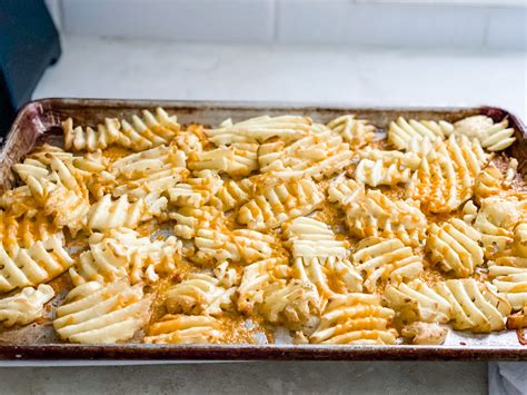 Idaho Nachos Layered With Crispy Waffle Fries Bacon And Ranch Dressing