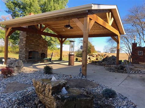 Covered Patio With Stone Fireplace Bubbling Rock And Waterfall